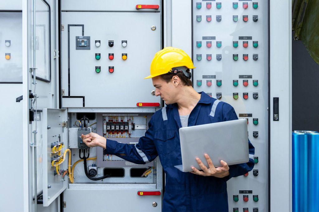 Electrical engineer working in control room.