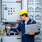 Electrical engineer working in control room.